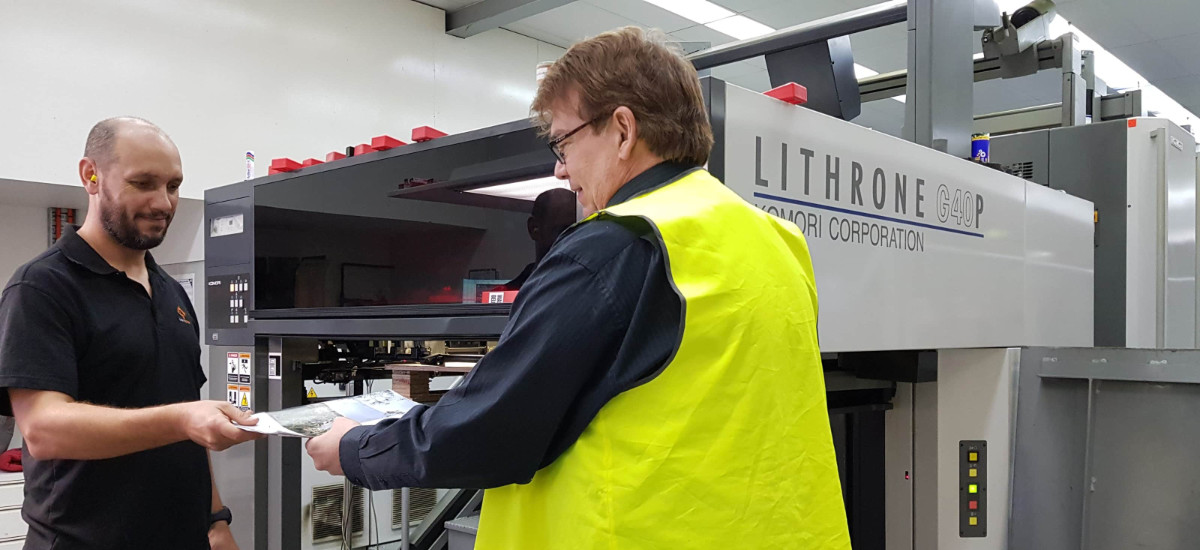 staff at Alpha Mail using printer staff at Alpha Mail using industrial printer